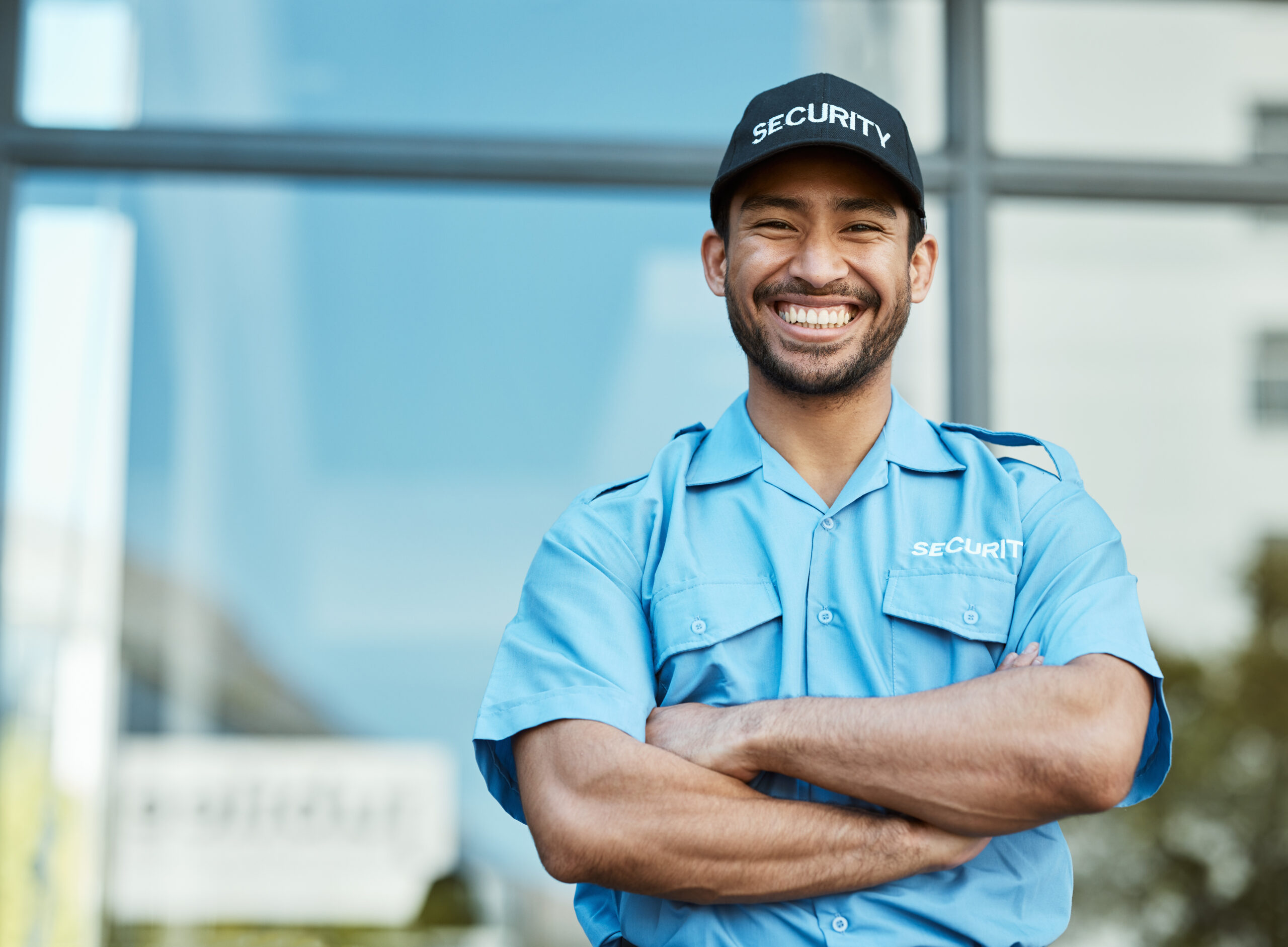 Happy man, portrait and security guard with arms crossed in city for career safety or outdoor prote.